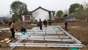 The aluminium frame of the base of the building under construction.