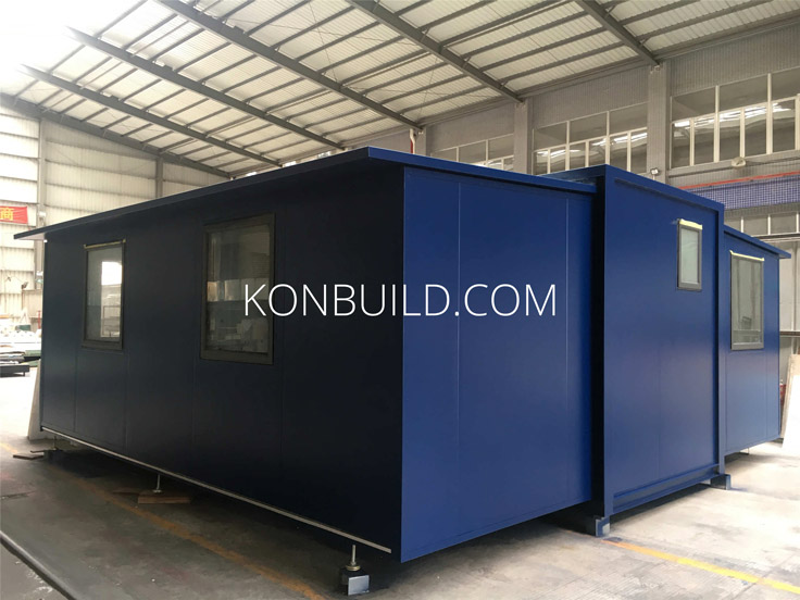 The rear view of a shipping container home.